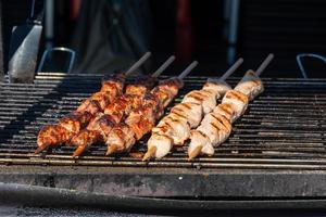 grilled meat skewers on a grill photo