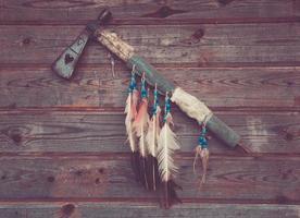 axe indians on a wooden wall photo