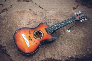 Wooden acoustic guitar outdoors in a street photo