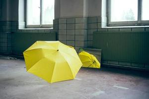 yellow umbrella in front of a mirror photo