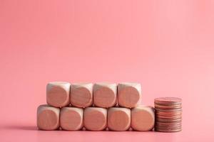 blank wooden dice for inserting text.on pink background photo