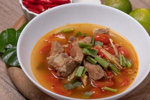 Tom Yum Pork Cartilage, spicy and sour Thai food. Popular. photo