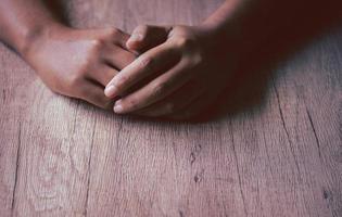 Asian woman's hand. Dark tone image, copy space. photo