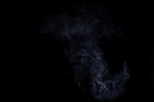 white smoke on a black background photo