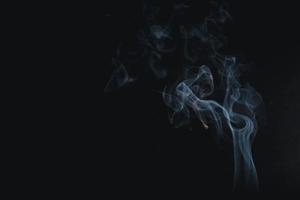 white smoke on a black background photo
