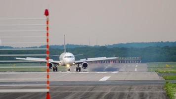 DUSSELDORF, GERMANY JULY 22, 2017 - Turkish Airlines Airbus A321 TC JRL in Star Alliance livery taxiing after landing, slow motion. Dusseldorf airport video