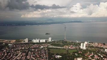 Aerial panning Gelugor, Sungai Dua with Penang Bridge as background. video