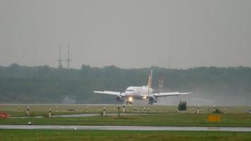 DUSSELDORF, GERMANY JULY 24, 2017 - Germanwings Airbus 320 landing and braking at rain, slow motion. Dusseldorf airport, Germany video