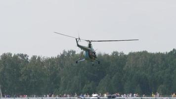 NOVOSIBIRSK, RUSSIAN FEDERATION JULY 28, 2019 - Vintage Helicopter Mi 1 performance aerobatics at Airshow at the Mochische aerodrome UNNM video