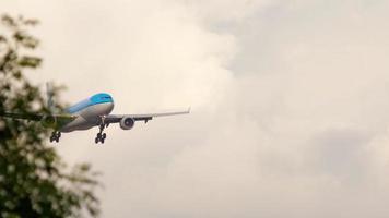 AMSTERDAM, THE NETHERLANDS JULY 25, 2017 - KLM Royal Dutch Airlines Airbus A330 PH AOM approaching before landing at runway 06 Kaagbaan at sunrise. Shiphol Airport, Amsterdam, Holland video