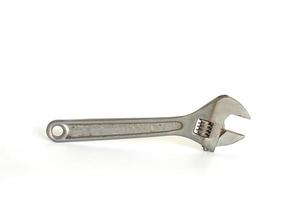 Old rusted adjustable spanner isolated on white background included clipping path. photo