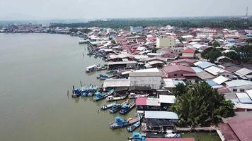 Aerial view fishing boat anchor outside the fisherman house video