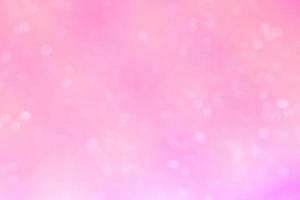 Abstract white bokeh on the pink glowing background photo