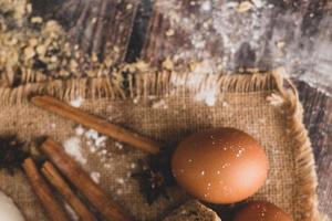 Cinnamon and eggs are placed on the sack and the flour photo