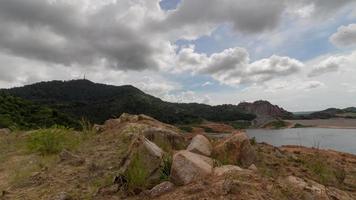 Time lapse rock with with white cloud blue sky video