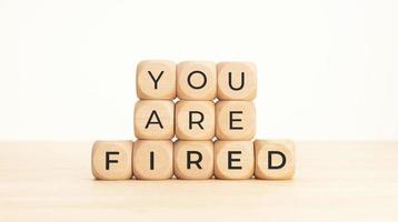 You are Fired phrase on wooden blocks. Unemployed concept photo