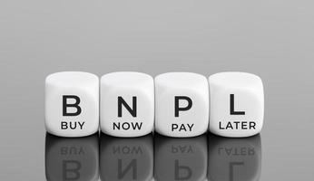 BNPL text on white blocks shape. Buy now pay later concept. Copy space photo