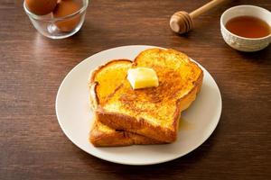 French toasted with butter and honey photo