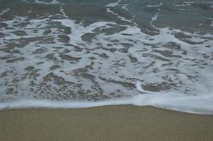 Beach waves and sand photo