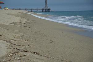 Beach waves and sand photo