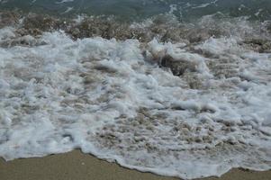 Beach waves and sand photo