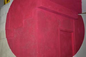 A red circle on a wall photo