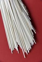 Homemade noodles flat in a pack on a white background photo
