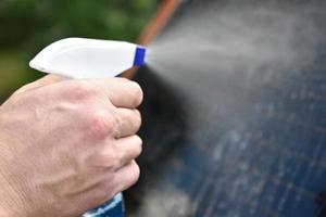 Spray for cleaning car windows and windows photo