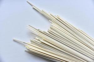 Homemade noodles flat in a pack on a white background photo