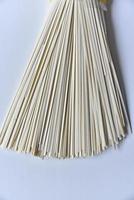Homemade noodles flat in a pack on a white background photo