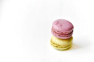 Delicious multicolored almond cookies isolated on a white background. Sweet multicolored macaroons. photo