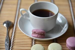 Tea pair with fragrant tea and pasta on a wooden mat. photo
