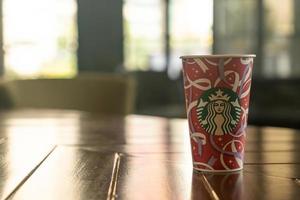 BANGKOK, THAILAND - Nov 24, 202 - Starbucks hot beverage coffee with Christmas theme on the table. photo