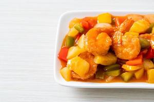 Stir-fried sweet and sour with fried shrimp photo