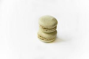 Delicious multicolored almond cookies isolated on a white background. Sweet multicolored macaroons. photo