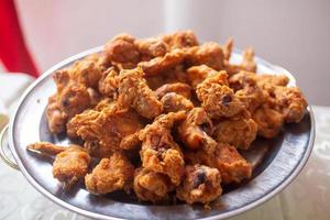 A plate full of home made fried chicken ready to be eaten photo