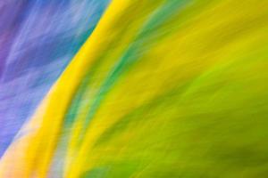 Abstraction in yellow blue green colors. The background is covered with small ripples. photo