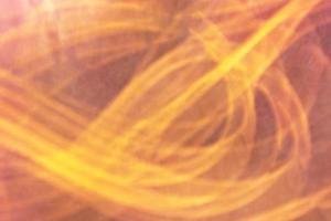 Blurred horizontal dark orange background banner from chaotic yellow lines. photo