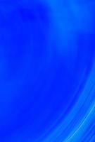Bright blue vertical abstract banner with curved lines at the bottom of the picture. photo