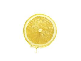 Fresh lemon juice dripping isolated on white background. Clipping path photo