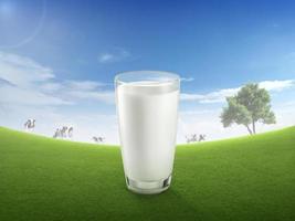 Fresh milk in glass and blurred landscape with cow on meadow. Healthy eating. Rustic style. Space for design photo