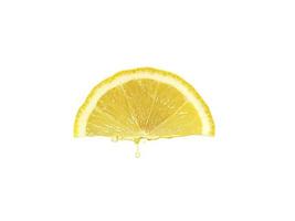 Fresh lemon juice dripping isolated on white background. Clipping path photo