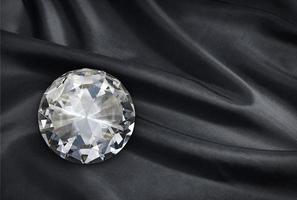 diamond on black fabric background photo
