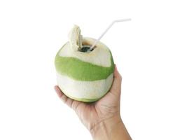 Male hand with a coconut on white background photo