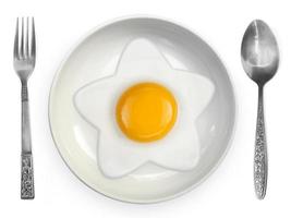 Star-shaped omelet  fried egg on ceramic plates isolated on white background photo