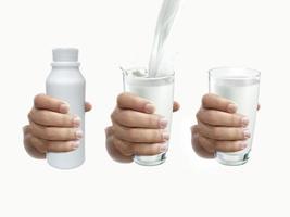 hand with glass of milk and milk bottle on a white background photo