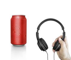 Hand with modern headphones and can on white background. concept music festival photo