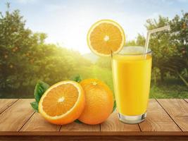 Fresh orange juice with fruits on wooden table and orange plantation with fruits in sun light photo