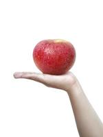 mano humana sosteniendo una manzana aislada en un fondo blanco foto
