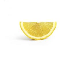 Ripe slice of yellow lemon citrus fruit isolated on white background with clipping path photo